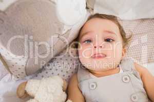 Portrait of a child in his bed with pillow
