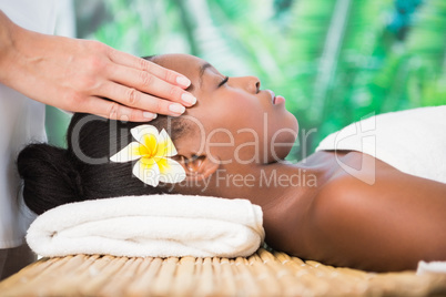 Pretty woman enjoying a head massage
