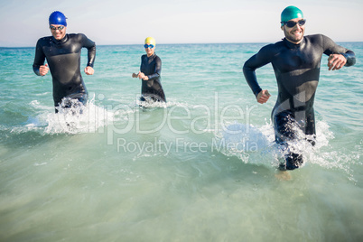 Swimmers running in the ocean