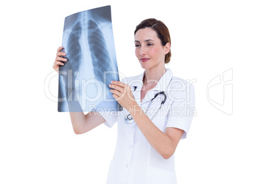 Confident doctor looking at x-ray