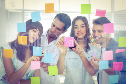 Young creative business people looking at the photo editor