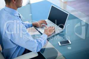 Businessman using his laptop