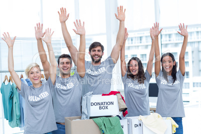 Volunteers raising their hands