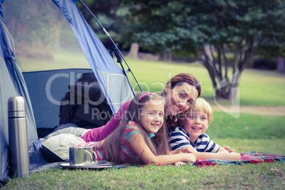 Mother and children camping in the park