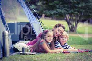 Mother and children camping in the park
