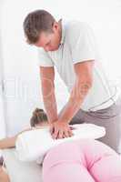 Physiotherapist doing back massage