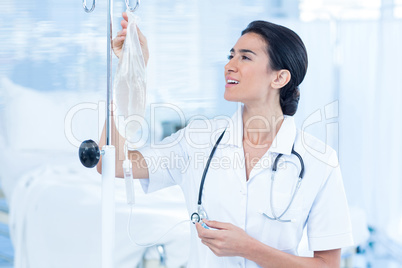 Nurse connecting an intravenous drip