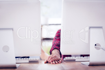 Business partners holding hands at office