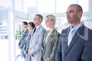 Business people standing in a row