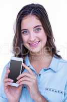 Pretty brunette smiling at camera with her smartphone