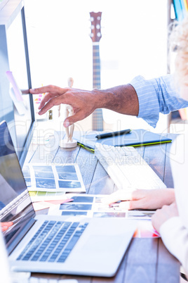 Close up of creative business people with laptop