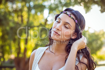 Pretty hipster relaxing in the park