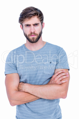 Unhappy handsome man looking at camera with arms crossed Unhappy handsome man looking at camera with arms crossed