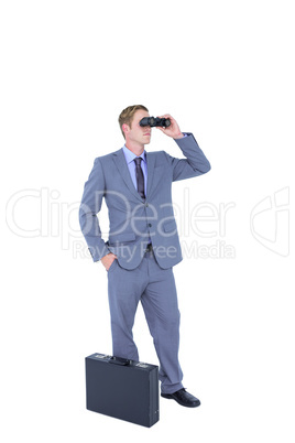 Businessman using binoculars