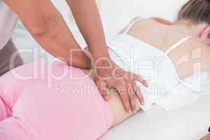 Physiotherapist doing back massage