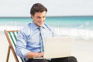 Businessman using his laptop