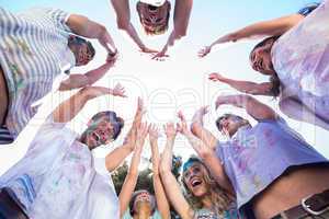 Happy friends covered in powder paint