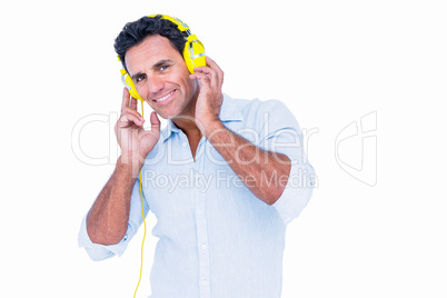 Handsome man listening music with headphone