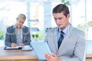 Serious businessman reading a file
