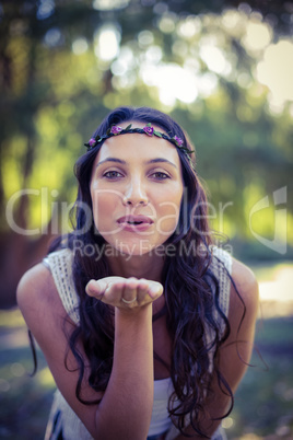 Pretty brunette blowing a kiss