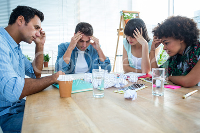 Exhausted creative business team riled up