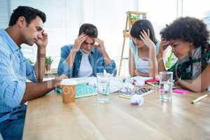 Exhausted creative business team riled up
