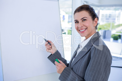 Happy businesswoman looking at camera