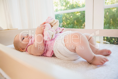 Beautiful cute baby girl in her crib