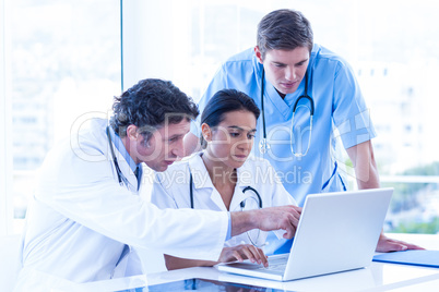 Medical team using laptop