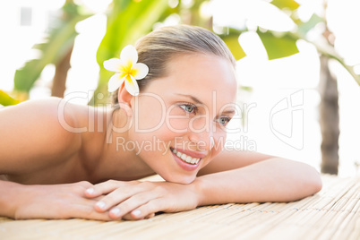 Peaceful blonde lying on massage table