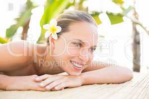 Peaceful blonde lying on massage table