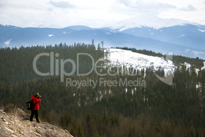 Photographer with mountains  and sky background