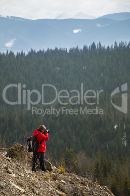 Photographer with mountains background