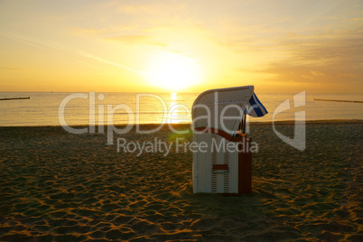 Beach chair on the beach at sunrise