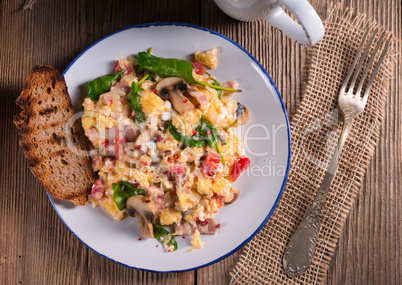 Scrambled eggs with tomatoes and spinach