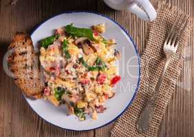 Scrambled eggs with tomatoes and spinach