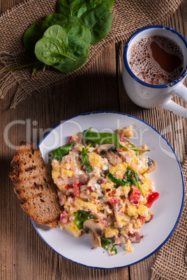 Scrambled eggs with tomatoes and spinach