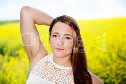 Woman posing in rape field