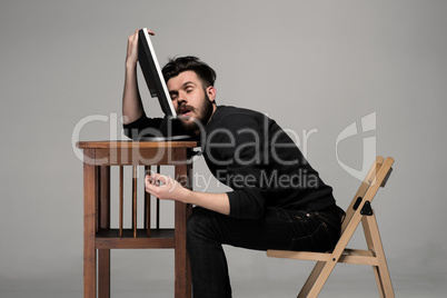 Businessman sleeping on a computer