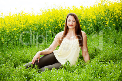 Woman in nature before the rape field