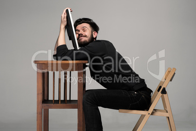 Businessman sleeping on a computer