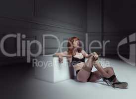 lingerie woman sitting on the floor