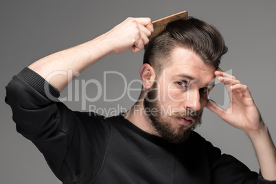 young man comb his hair