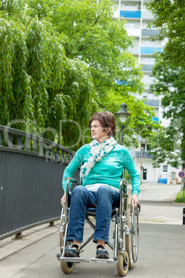 Woman with wheelchair in the park