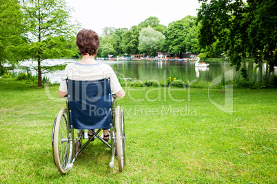 Woman with wheelchair in the park