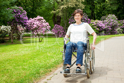 Woman with wheelchair in the park