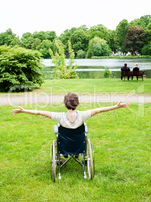Woman with wheelchair in the park