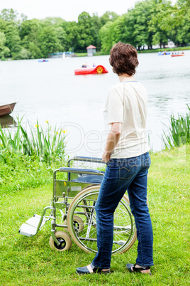 Woman with wheelchair in the park