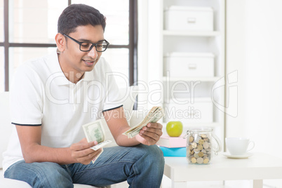 Indian guy counting money