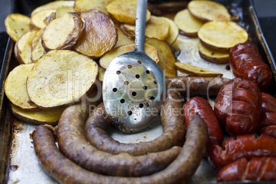 fried potatoes and sausages